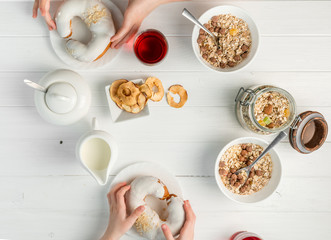 People eating brunch together, oatmeal fruits, topview