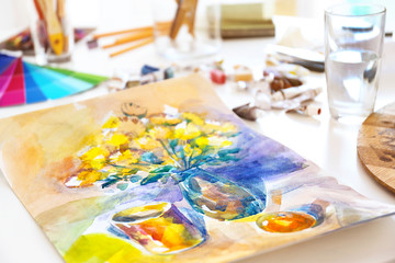 Beautiful water-color drawing on white table, close up view
