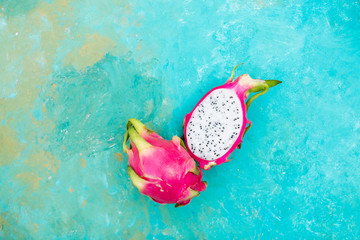 Pitahaya on a turquoise background. Exotic fruits. Copyspace
