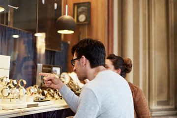 Woman and man in front of clothing store