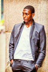 Fototapeta na wymiar African American Teenage Boy thinking outside in New York