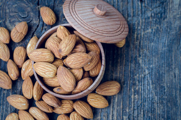 Almonds on the old wooden background