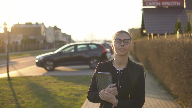 Woman walking in old city at sunset. slow mo