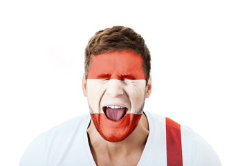 Screaming man with Austria flag on face.