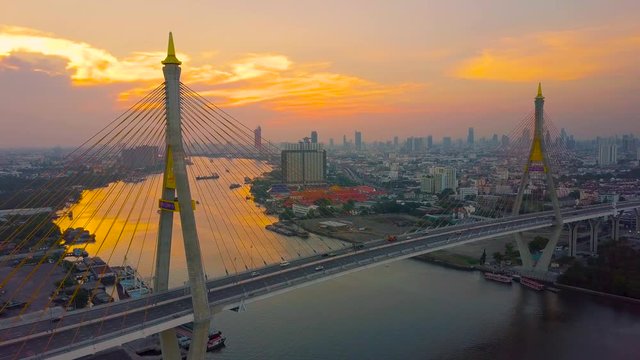 Beautiful sunset view from a drone of Bhumibol Bridge in Bangkok , Bridge of transportation for import , export , Bangkok ,Thailand
