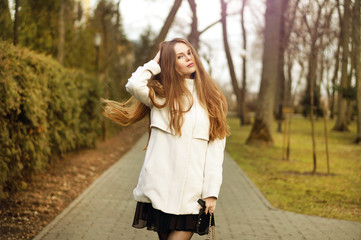 Attractive young woman enjoying her time outside in the park