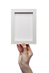 woman hand hold a photo frame isolated white.