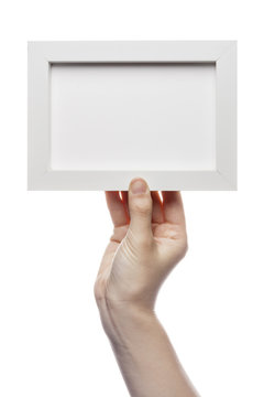 woman hand hold a photo frame isolated white.