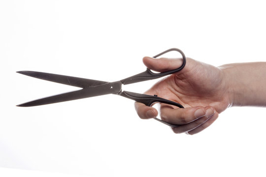 Woman Hand Hold A Scissors Isolated White.