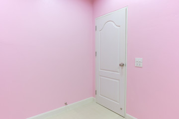 empty pink room with door in home