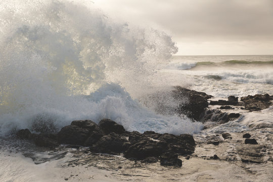 Ocean Waves Crashing into Rocky Shore