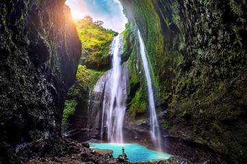 Fototapeta na wymiar Madakaripura Waterfall is the tallest waterfall in Java and the second tallest waterfall in Indonesia.