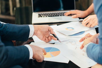 Business man working at office with laptop and documents,businessmen using documents at meeting,Teamwork Togetherness Unity Variation Support Concept,Business team analyzing financial documents.