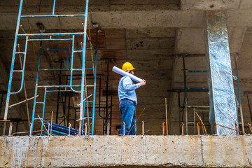 young engineer to check the construction site.