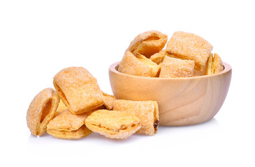 Crispy pineapple pie in wooden bowl isolated on white background