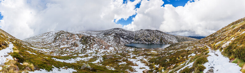 Beautiful Panorama of Blue Lake and snow covered mountains. Kosciuszko National Park, Australia