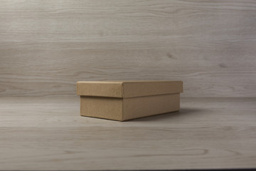 Cardboard plain Box on white wooden Background
