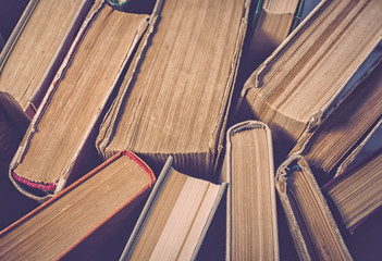 Old books. Top view. Vintage toning. Selective focus