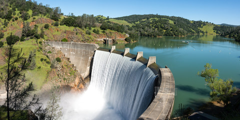 Water spills over the top of Englebright Dam on the Yuba River. A larger than normal snowpack in...