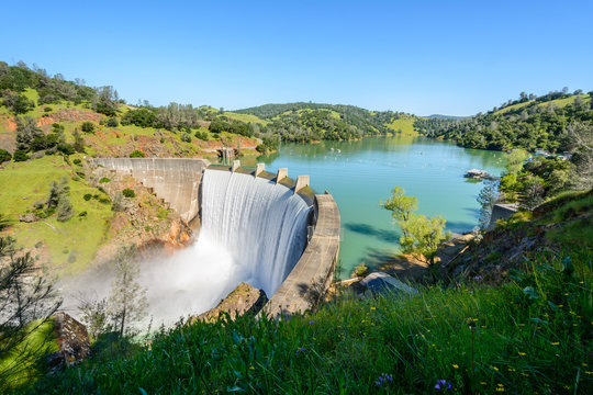 Water spills over the top of Englebright Dam on the Yuba River. A larger than normal snowpack in the Sierra Nevada Mountains has increased runoff into lakes and rivers in California.