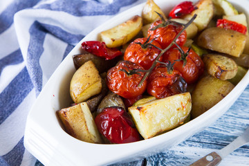 roasted vegetables in a ceramic pot. closeup view, selective focus