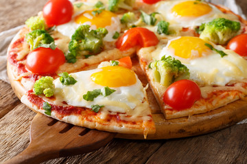 Sliced pizza with eggs, broccoli, tomatoes and parsley close-up. horizontal