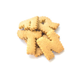 Closeup pile of brown biscuit in english alphabet isolated on white background