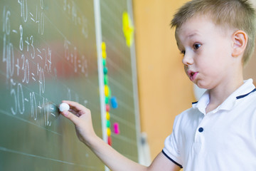 Schoolboyl at the blackboard