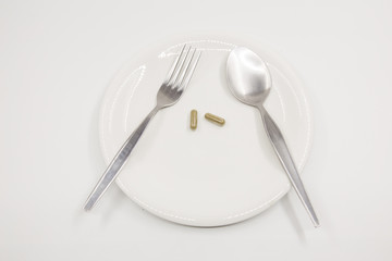 Capsule on white dish