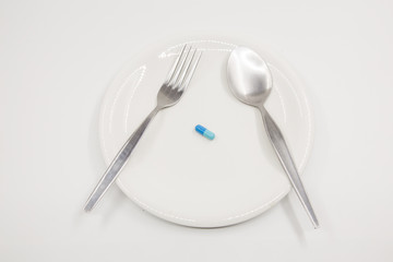 Capsule on white dish
