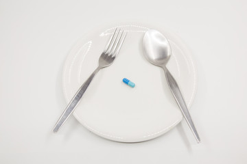 Capsule on white dish