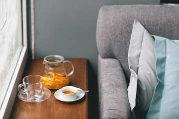 Fruit vitamin tea with orange, honey, sea-buckthorn and spices with glass cup on wood background