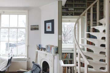 staircase with built in book shelfs in an apartment