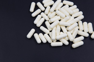 Capsule on black texture