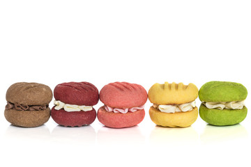 Row of Colorful Cream Cookies Isolated on White