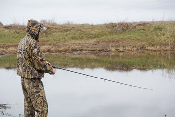 fishing on a spinning. catching of predatory fish. a pike on a spinning