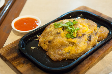 Omelette or Thai-style fried green in a hot pan. / Thailand Food of  Vegetarian , No meat-Made from mushroom
