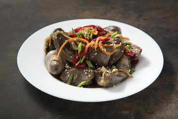 Warm salad from turkey hearts