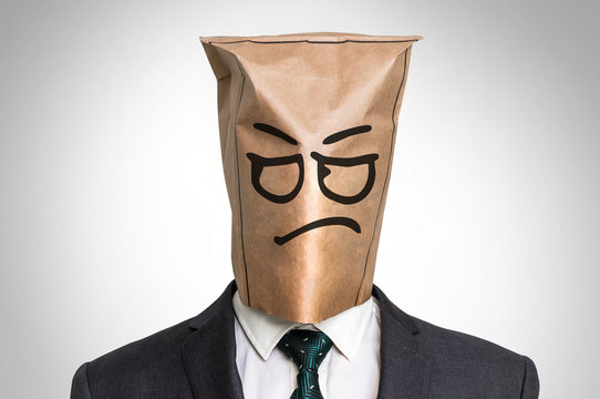 Businessman with a bag on the head - with sad face