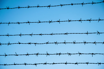 the barbed wire on blue sky background