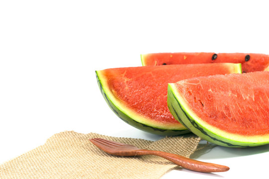 the watermelon isolated on white background with wood fork and sack cloth