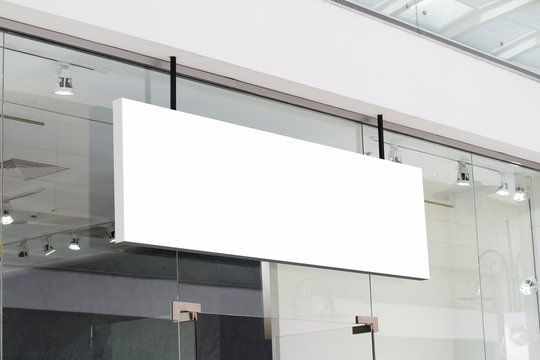 horizontal white signage on shop front