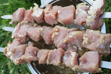 juicy fried meat on skewers outdoors