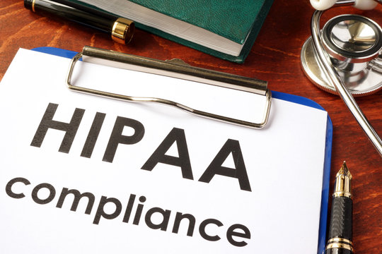 HIPAA Compliance Form On A Clipboard. Medical Privacy Concept.