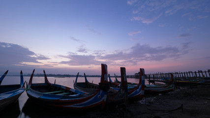 Colorful wooden boat in early morning at u-bein bridge, Mandalay, Myanmar