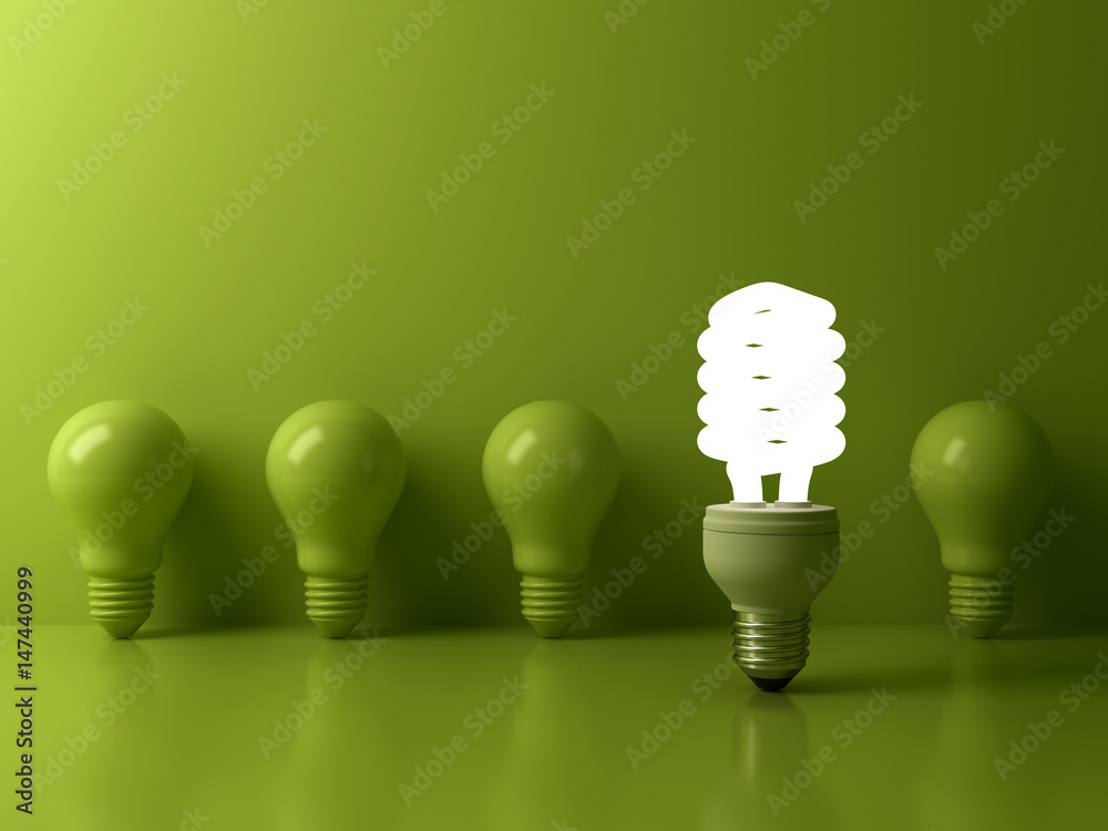 Poster eco energy saving light bulb , one glowing compact fluorescent lightbulb standing out from unlit inc