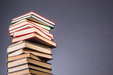 Stack of books isolated on gray with copy space