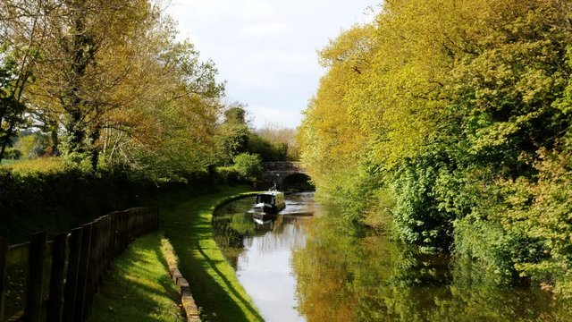 English canal tow path lush green trees- Shropshire Union Canal, Staffordshire, England - May 1st 2017