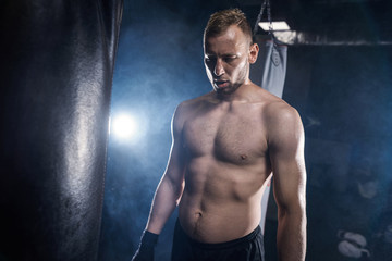 Fototapeta na wymiar Male boxer preparing before training session