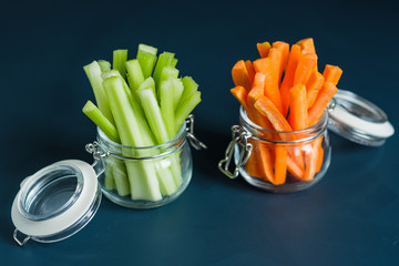 Healthy diet food. Carrots and celery chopped with chopsticks.